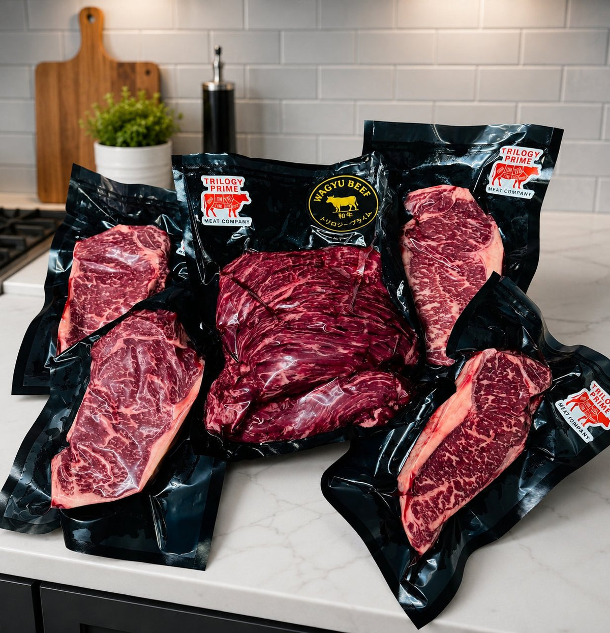 Vacuum-sealed Trilogy Prime Wagyu NY strips and fajita cuts on a marble counter