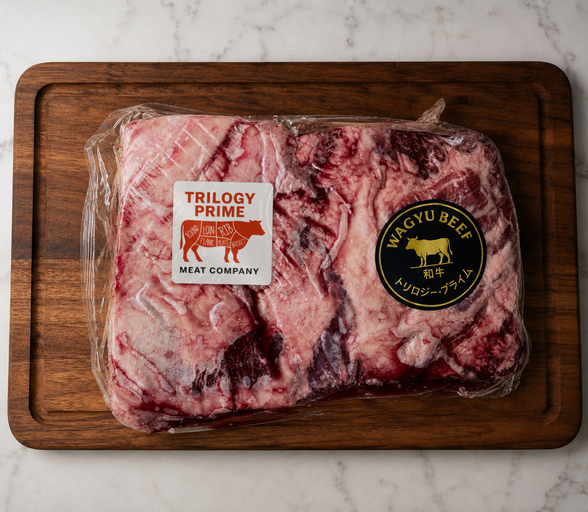 Whole vacuum-sealed Trilogy Prime American Wagyu cut on a walnut board